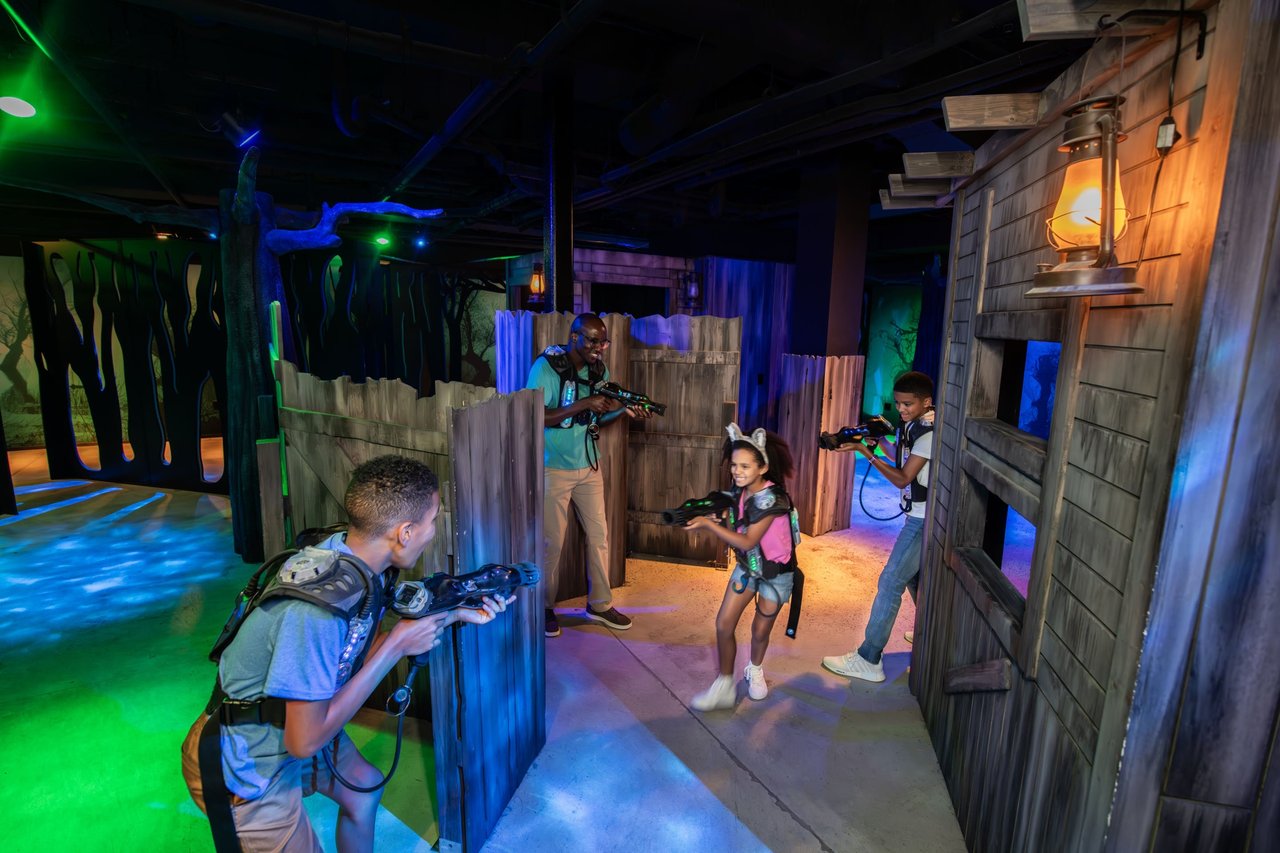 Family enjoying a colorful laser tag game