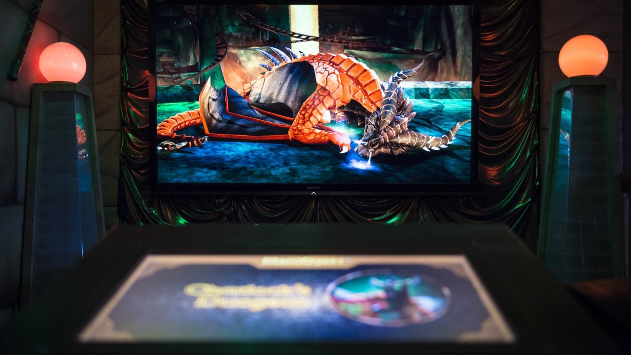 A digital screen displaying a sleeping MagiQuest dragon.