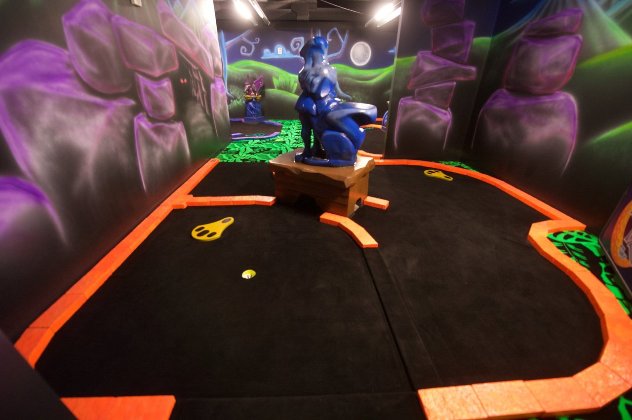 a putting hole on the Glow Golf course