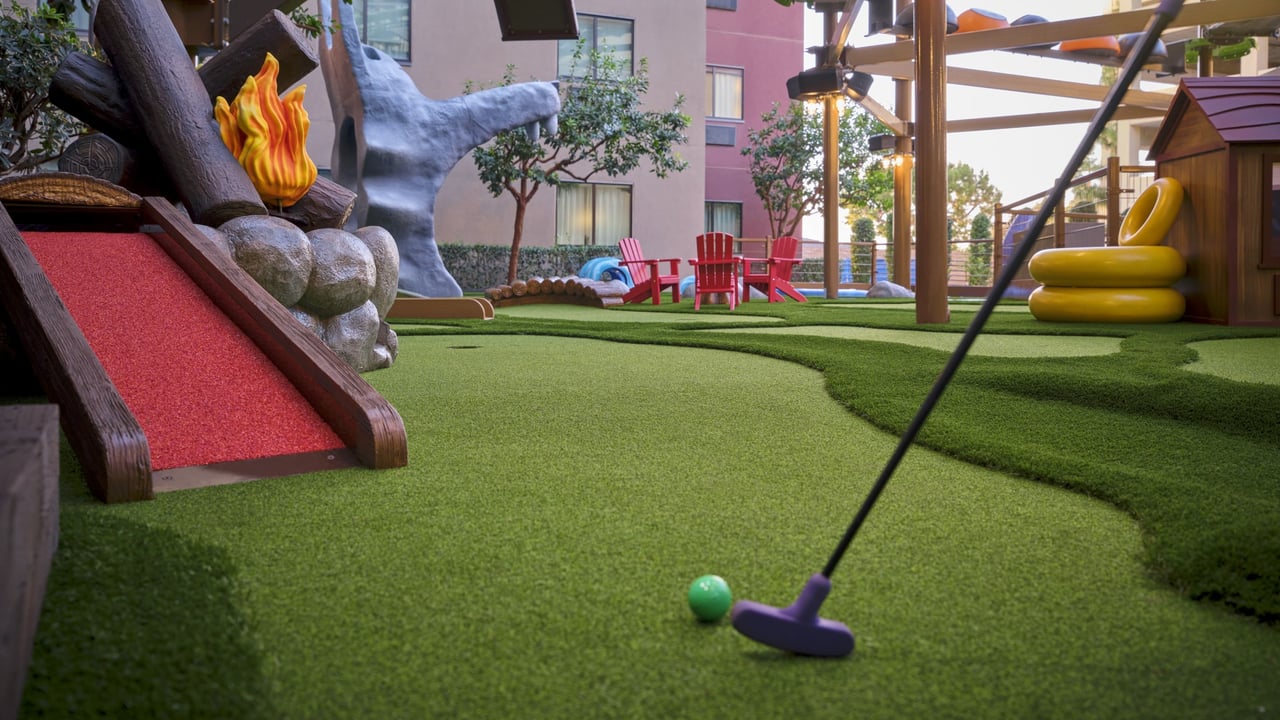 Colorful mini golf in courtyard playground