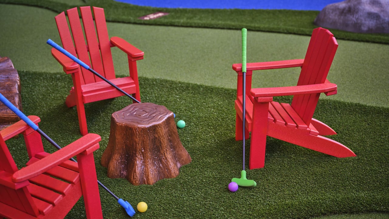 Small golf setup with bright chairs