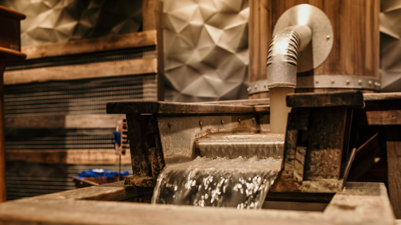 Water flowing through a wooden sluice