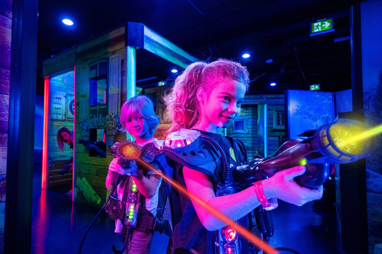 Family enjoying Laser Tag game together