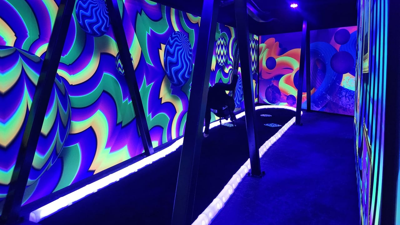 Neon, psychedelic walls in mini golf course