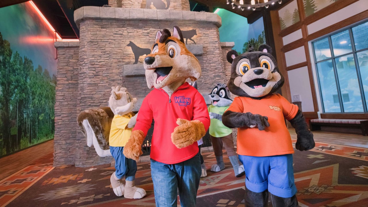 Animal mascots meeting people at the food tables