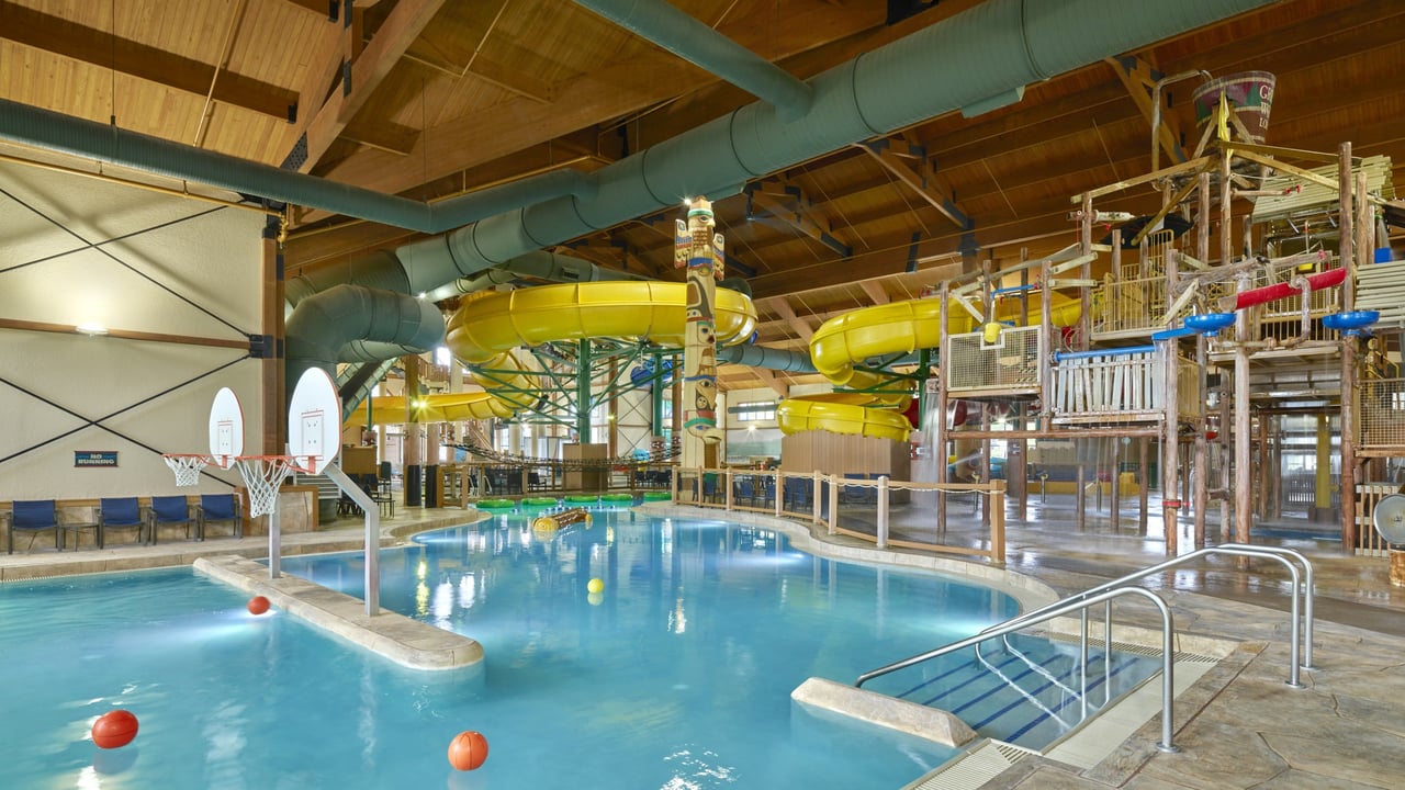 A large indoor water park featuring multiple water slides and attractions for visitors of all ages.