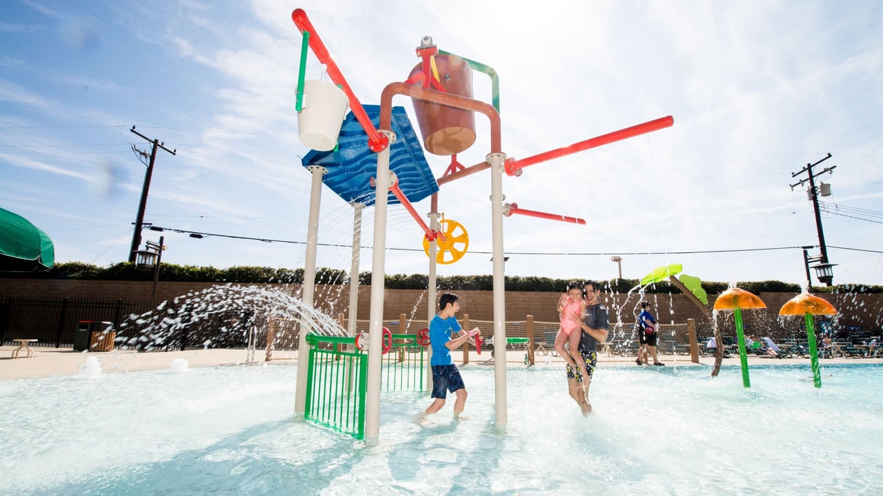 kids playing in an outdoor kiddie pool