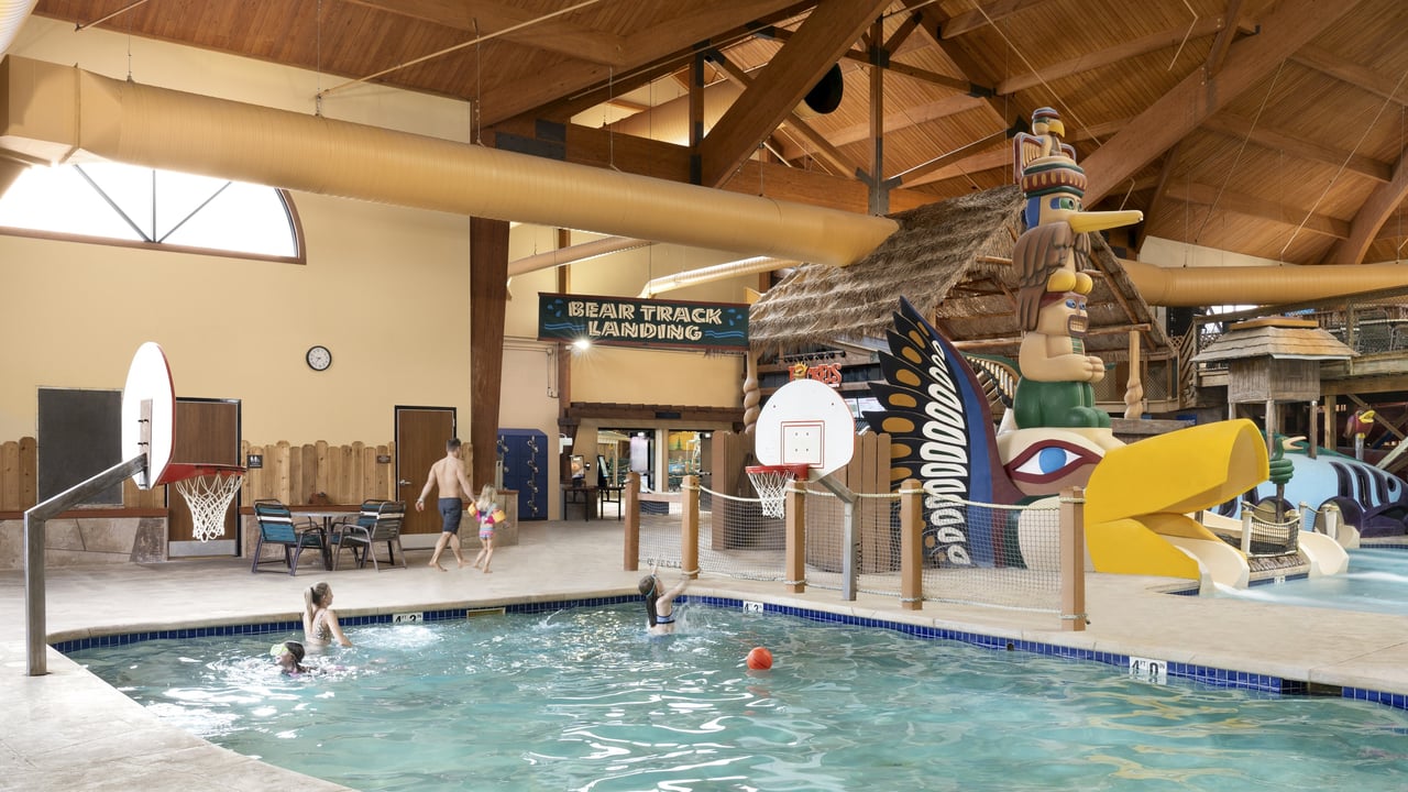Family enjoying basketball in the indoor pool