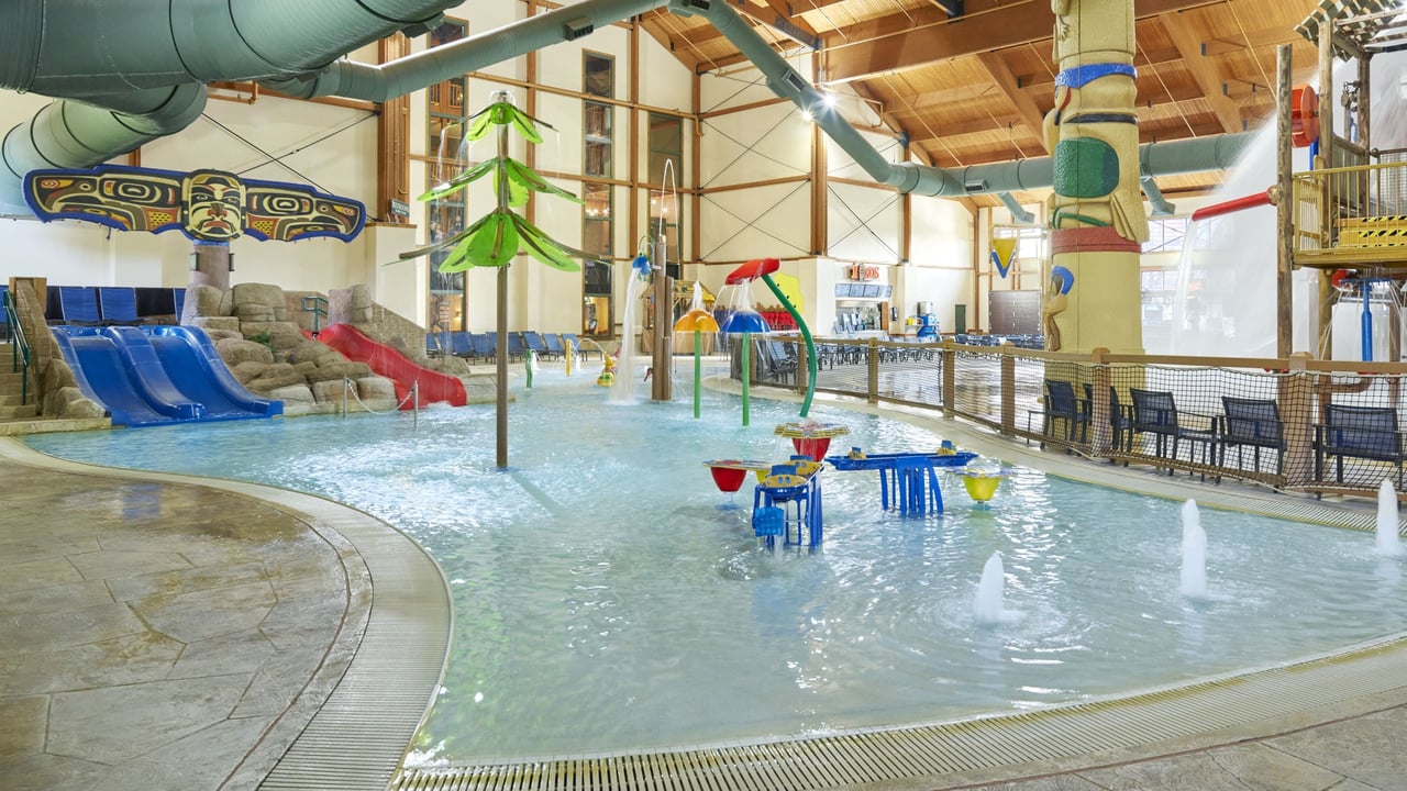 indoor waterpark featuring colorful water slides