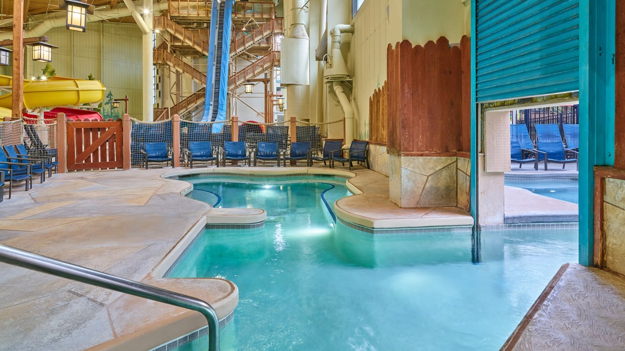 blue doggy door separating the indoor and the outdoor hot tub area