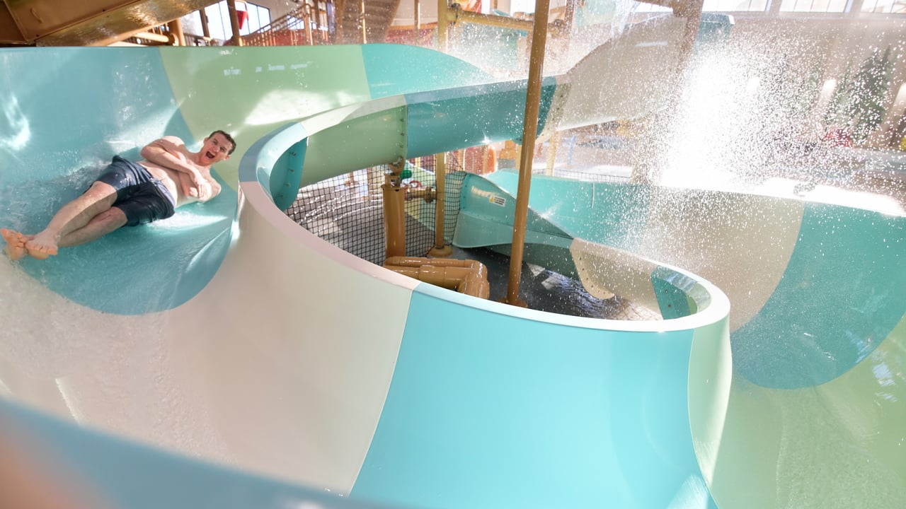 Dad going down a body water slide