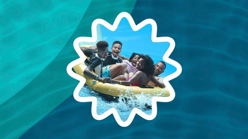 Family sliding down a water slider