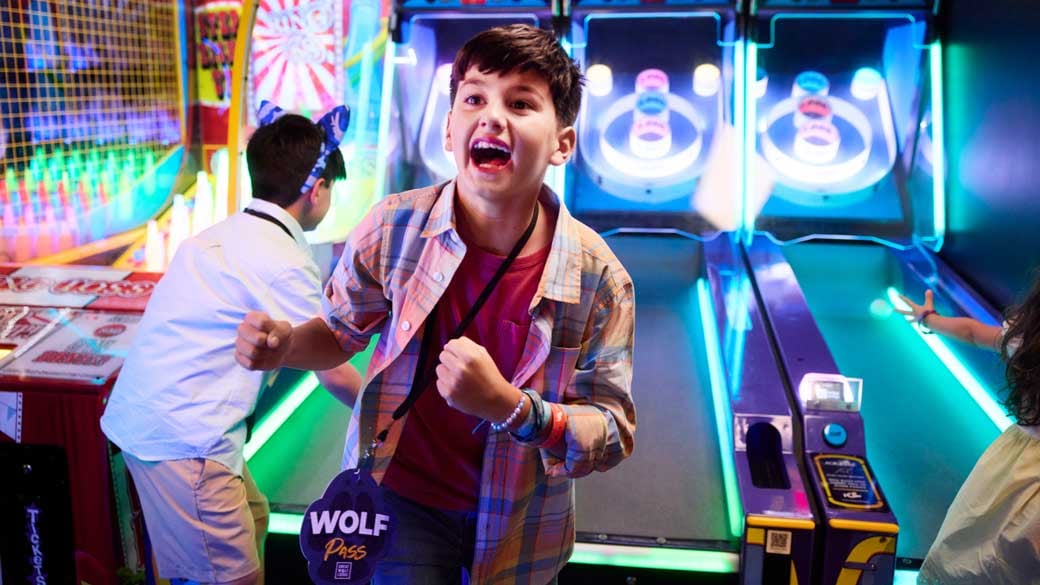 boy happy after winning at the arcade