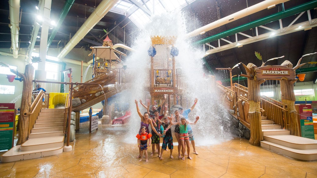 family having fun in an indoor water park