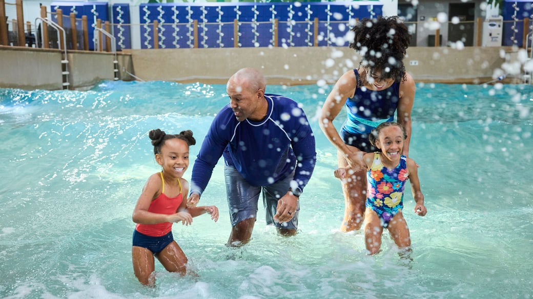Family enjoying an indoor pool