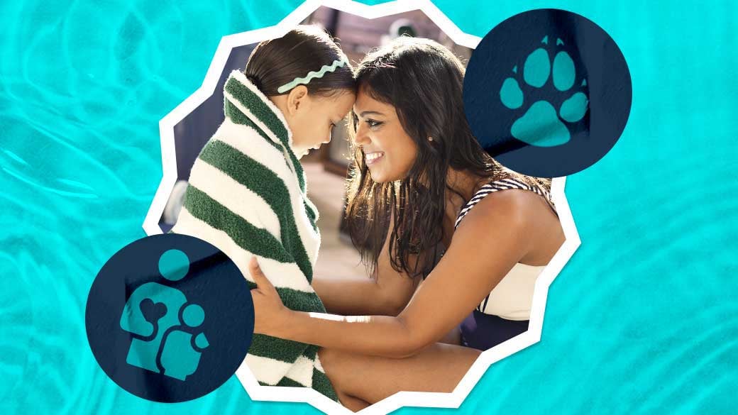 Mother cover daughter in a towel