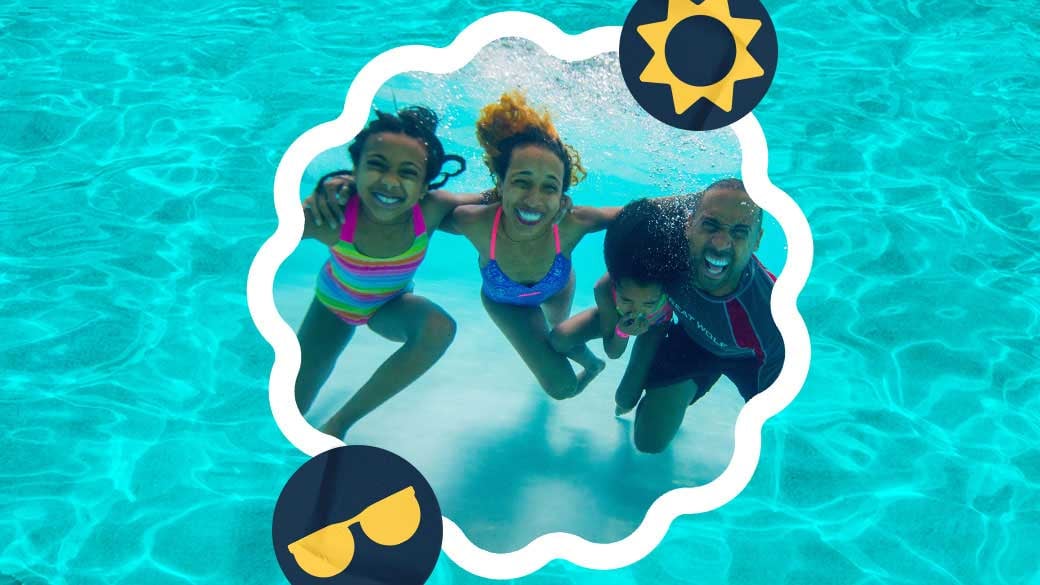 Family pose for their picture to be taken under water 