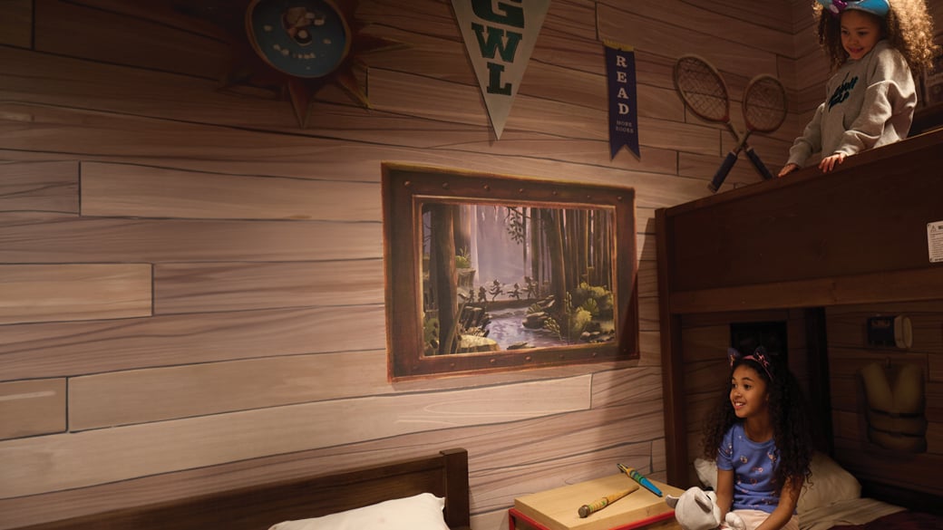 Two little girls sharing a wolf den suite at Great Wolf Lodge