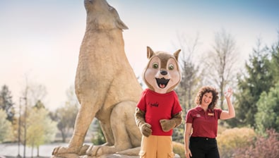 wiley and staff member welcoming a family