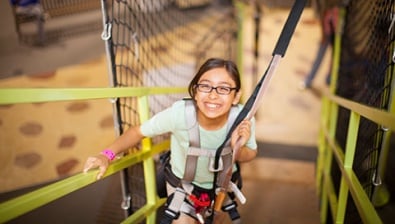 A girl plays in the Great Wolf Adventure Park at Great Wolf Lodge indoor water park and resort.