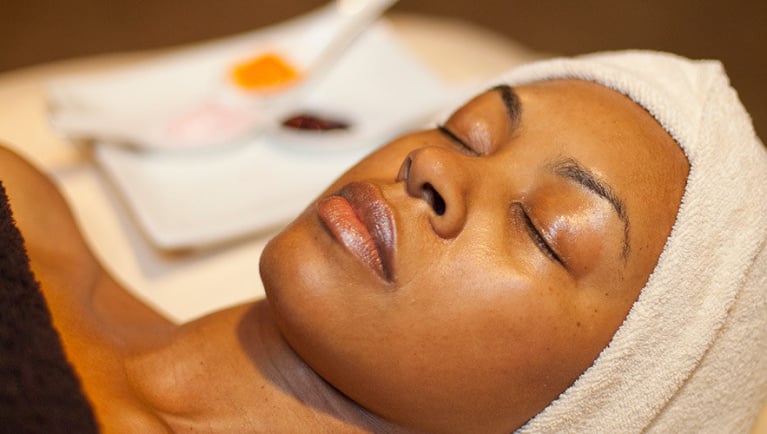 Woman relaxes at the spa at Great Wolf Lodge indoor water park and resort.