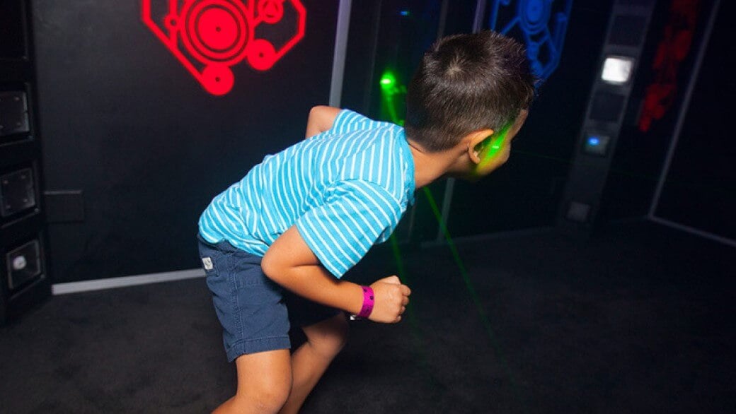 A boy plays Laser Tag at Great Wolf Lodge indoor water park and resort.