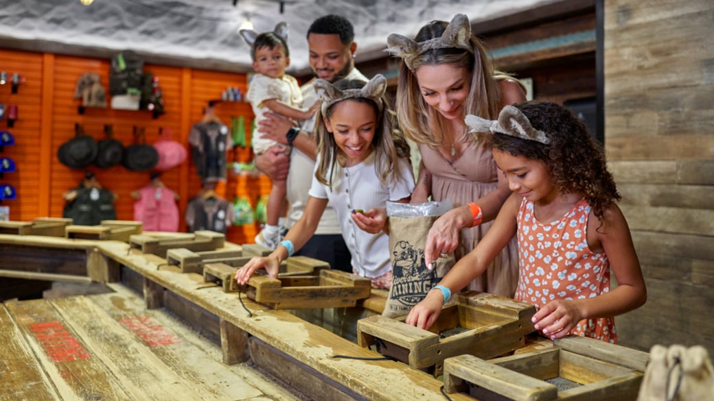 Family interacting with Oliver's mining