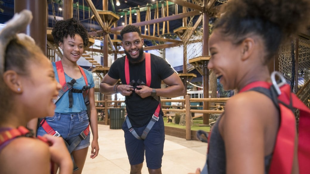 Group of friends at the Howlers Peak Ropes Course at Great Wolf Lodge indoor water park and resort.