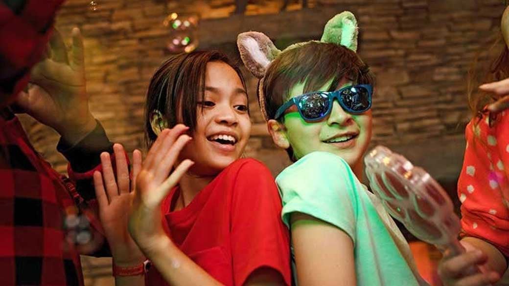 Mother and daughter dancing at dance party