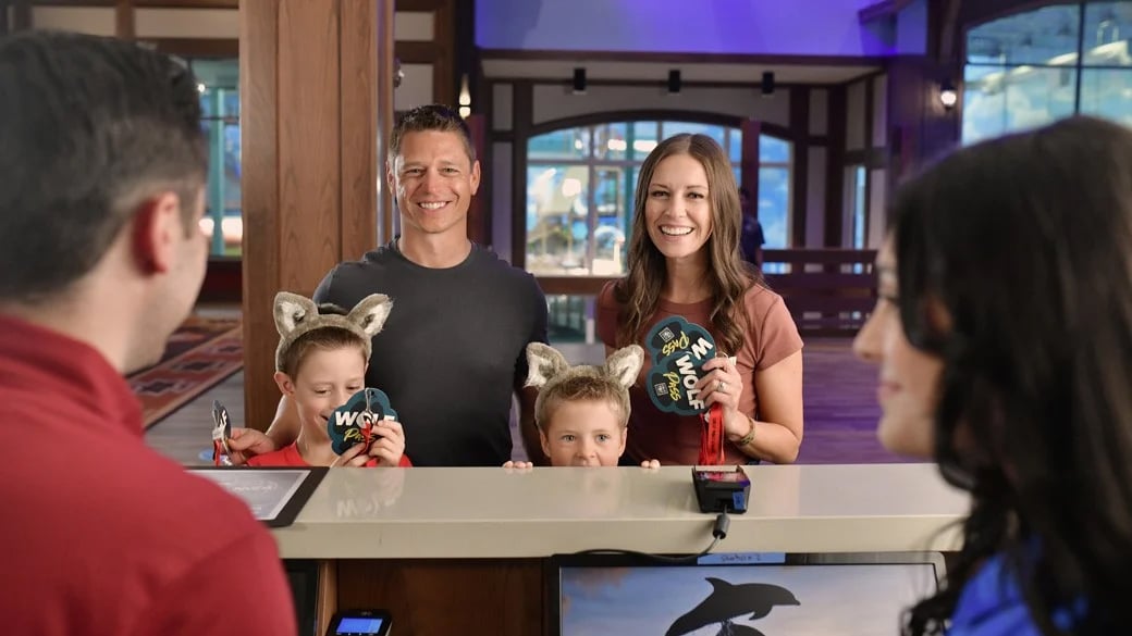 Family getting game passes at Great Wolf Lodge lobby