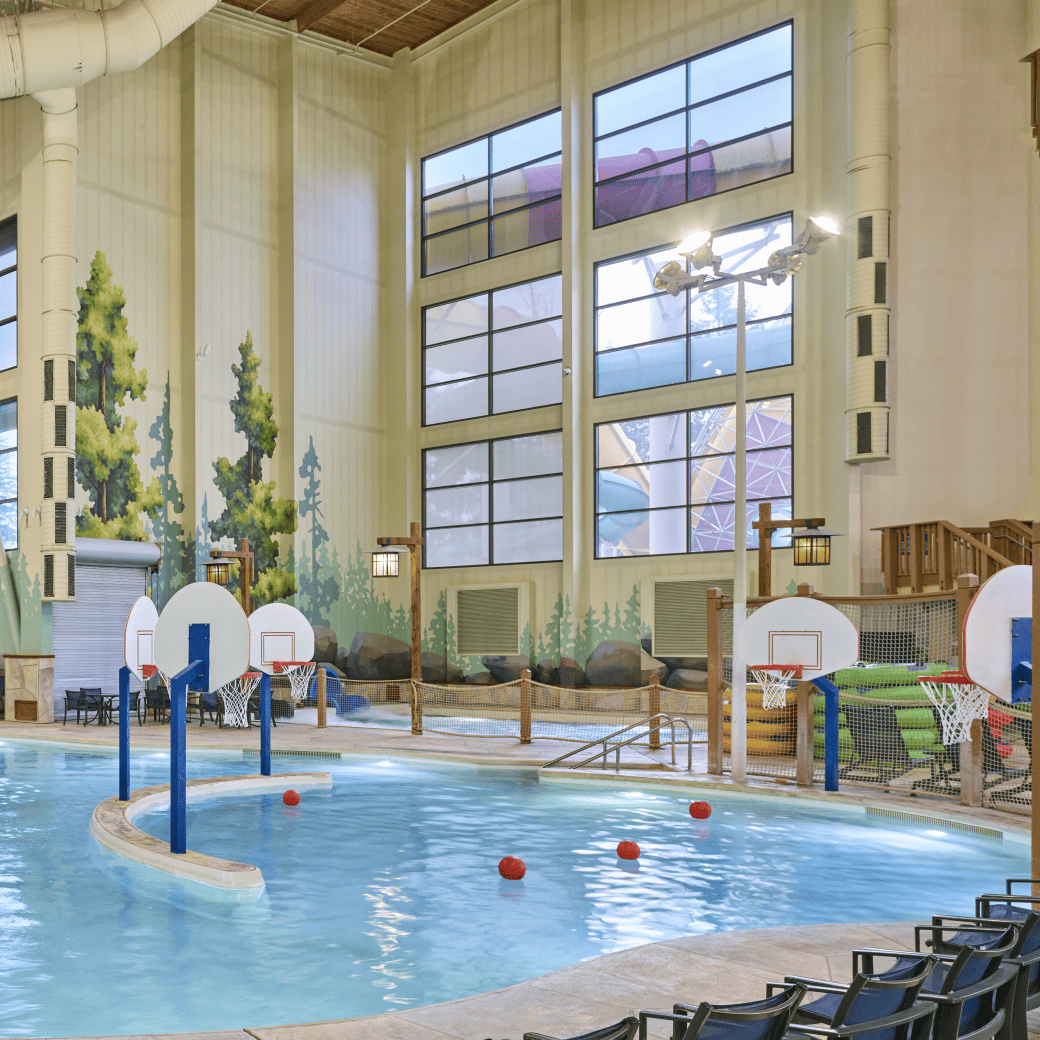 activity indoor pool with basketball hoops