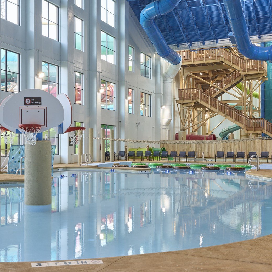A large indoor pool equipped with a colorful water slide