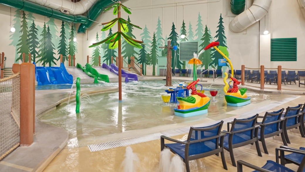 mother and child enjoying in a kidee pool in waterpark