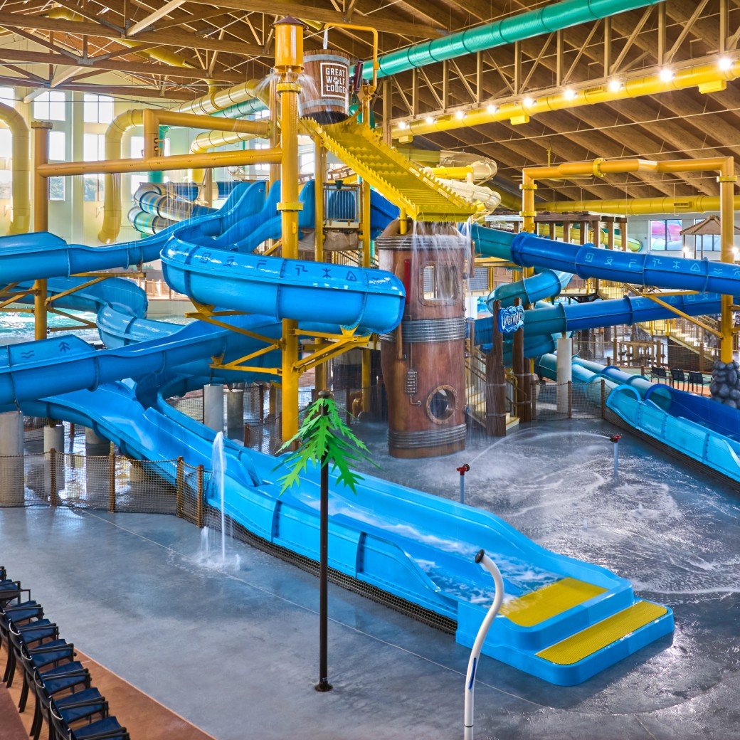 A wide shot of the water treehouse as water splashes down from a bucket