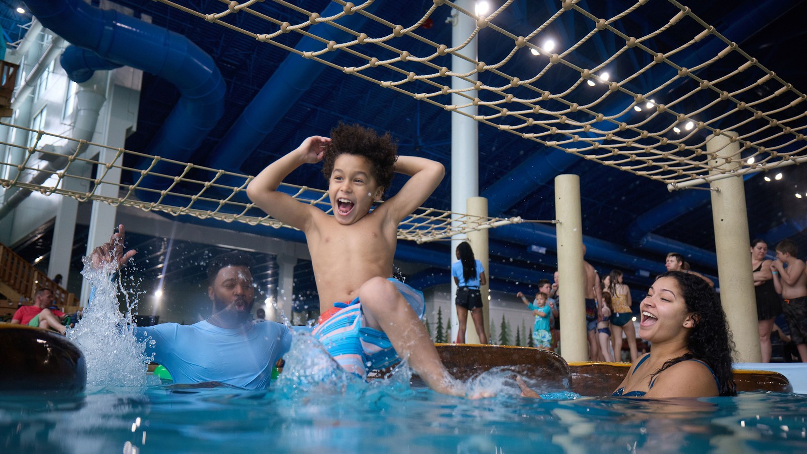 Kid jumping  into the pool