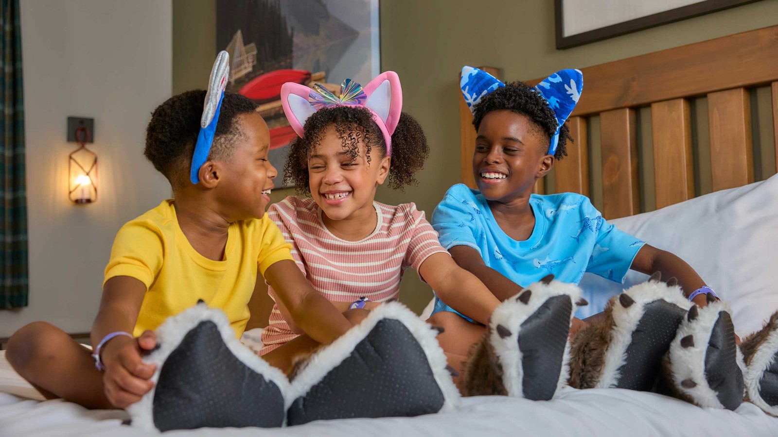 kids sitting on bed and smiling