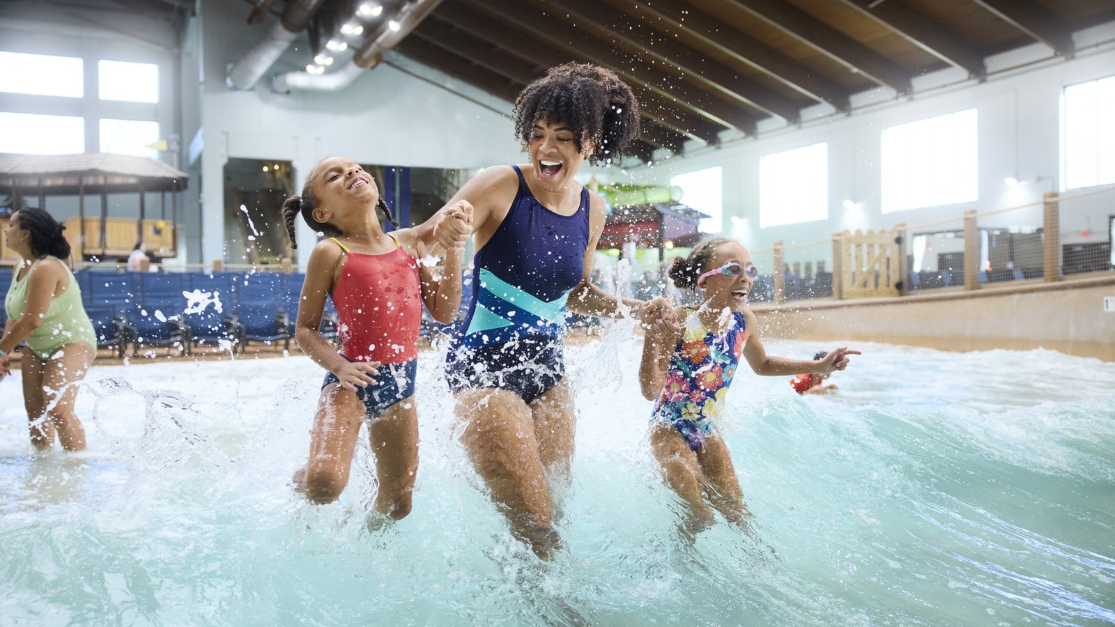 A family taking a selfie with a character at Great Wolf Lodge