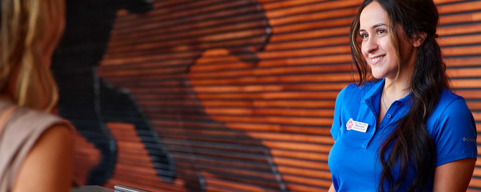 Staff member attending a guest at the reception