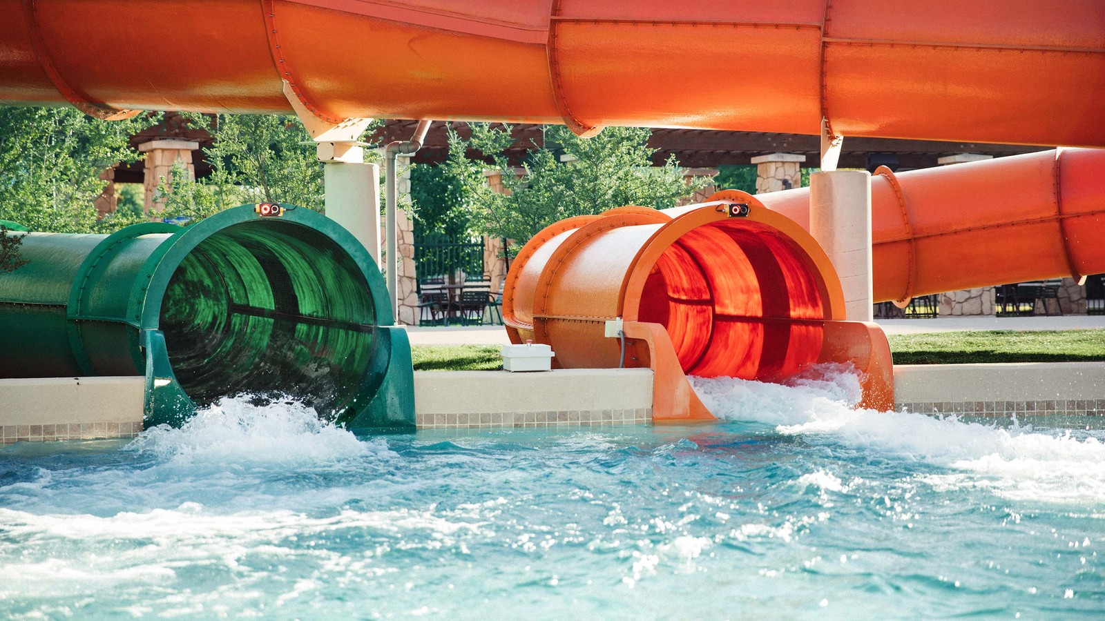View of an outdoor green and orange water slides