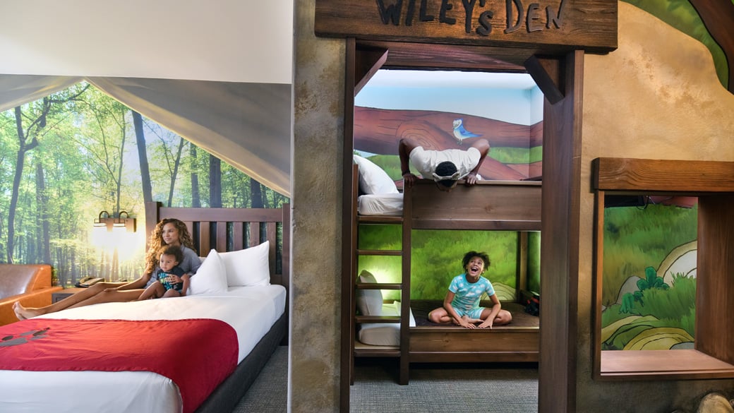 family of four enjoying the wolf den signature suite