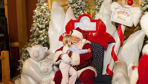Santa Claus hugs a child