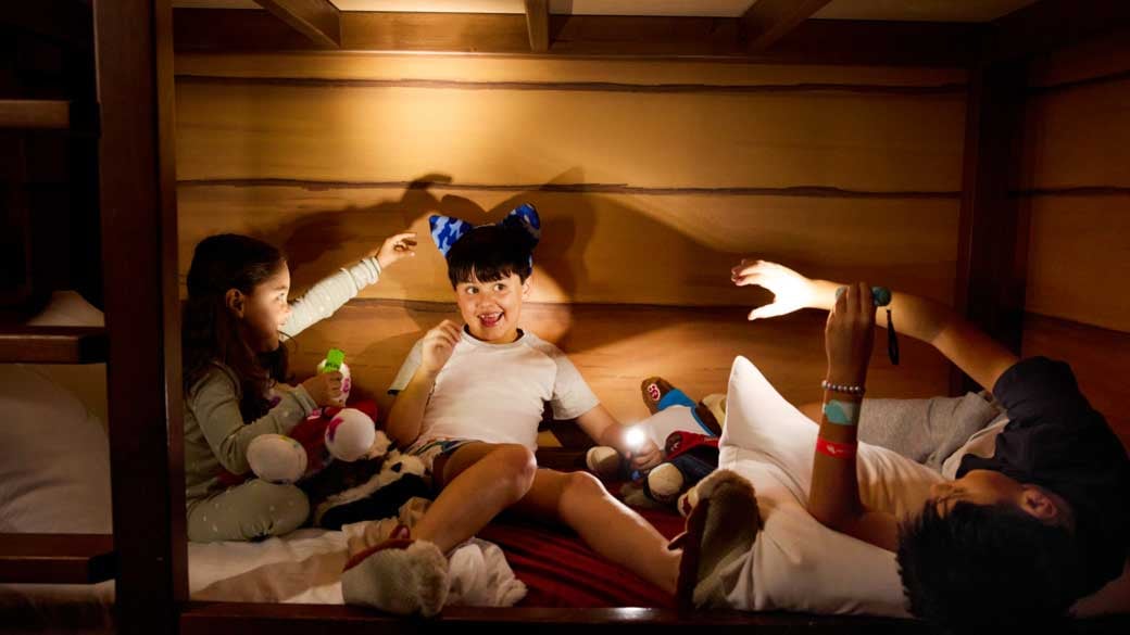 family of four enjoying the wolf den signature suite