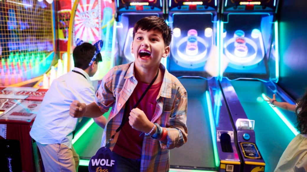 boy excited after wining at the arcade