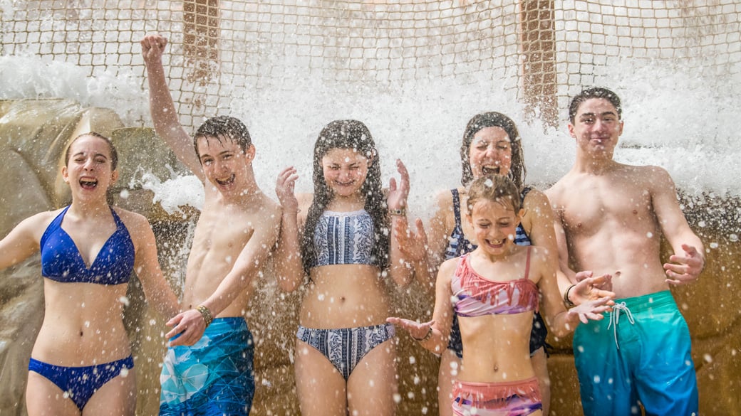 a family enjoying great wolf lodge attractions