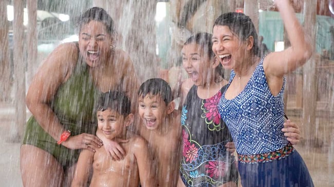 teens getting splashed with Water