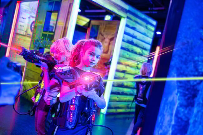 daughters playing with a laser gun