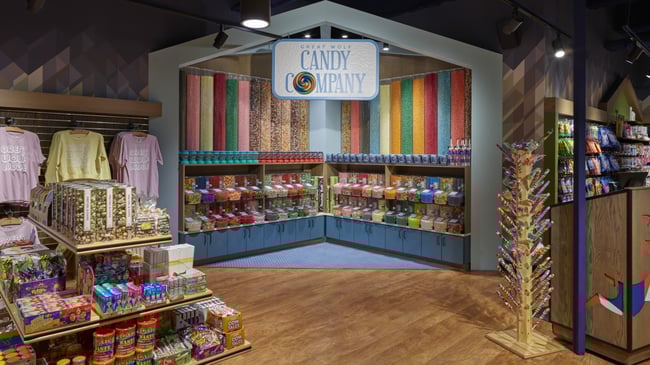 two girls looks at the candy towers.