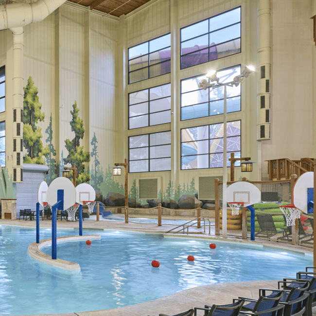 activity indoor pool with basketball hoops