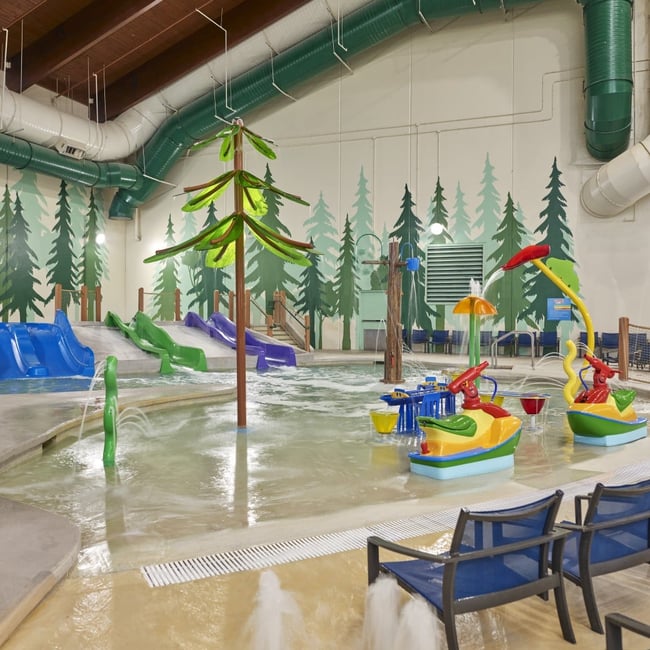 Vibrant water park featuring colorful slides and play areas designed for children.