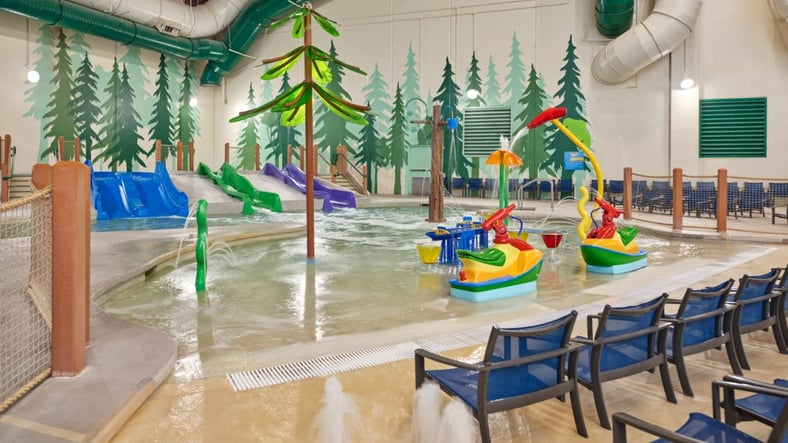 Little girl enjoying cub paw pool